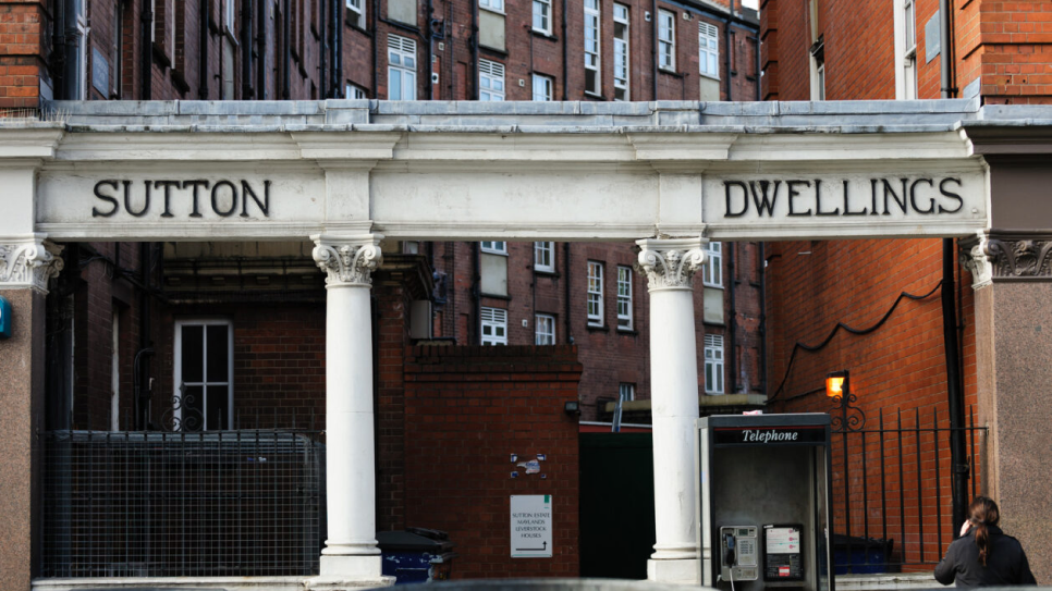 Old entrance to the Sutton estate with a sign saying Sutton Dwellings