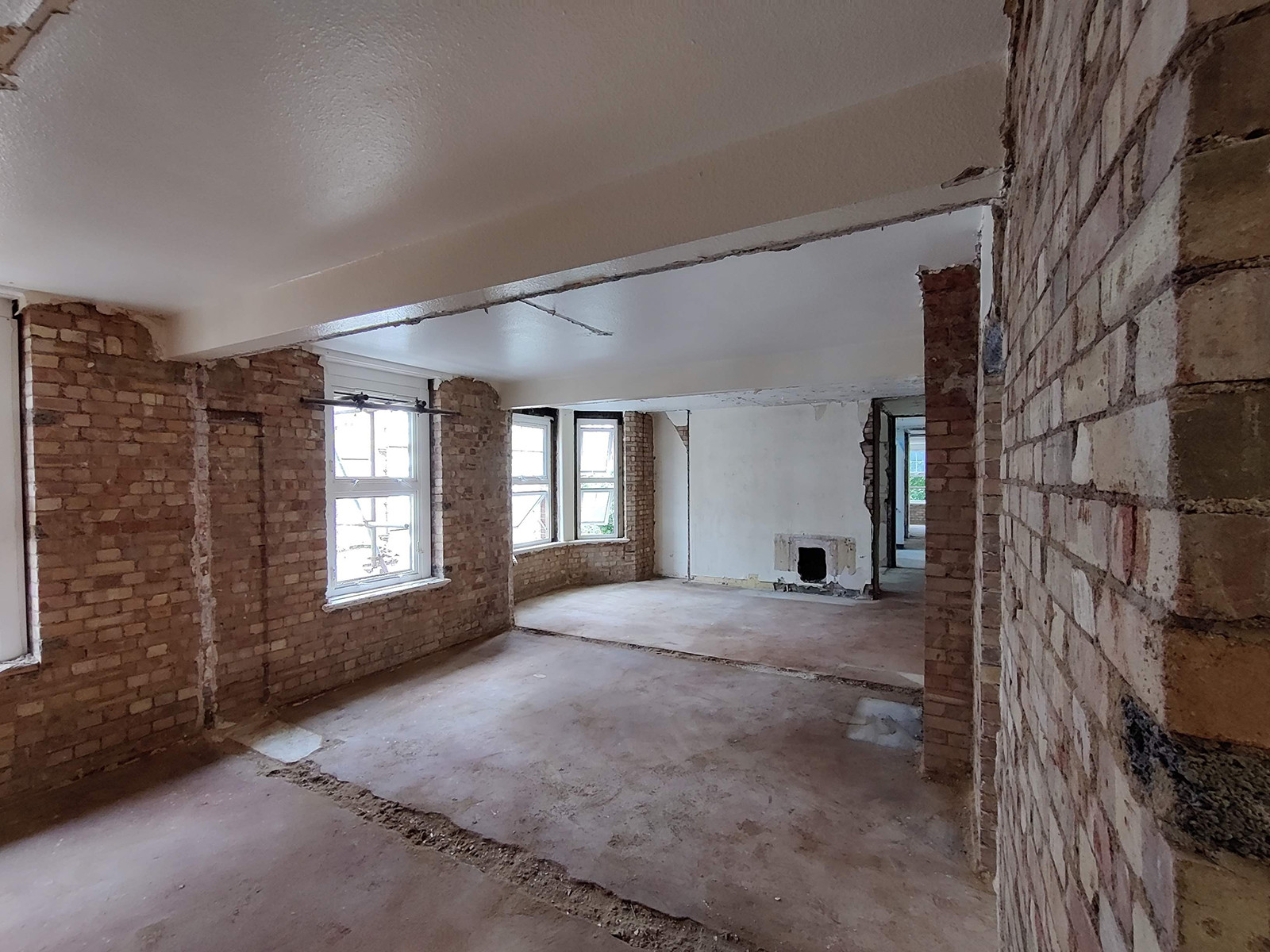 The interior of a flat, stripped back to bare walls.